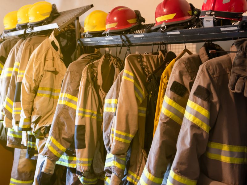 uniform of firefighters hanging on a rack