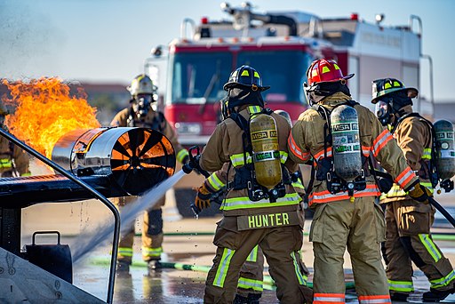 Firefighters battle simulated aircraft fires