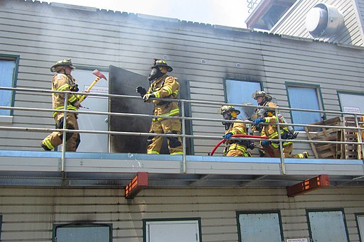 firefighters battling a fire during training