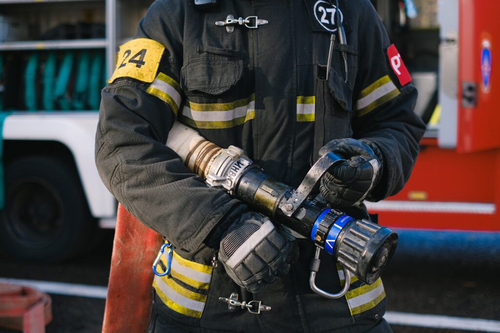 firefighter holding a hose