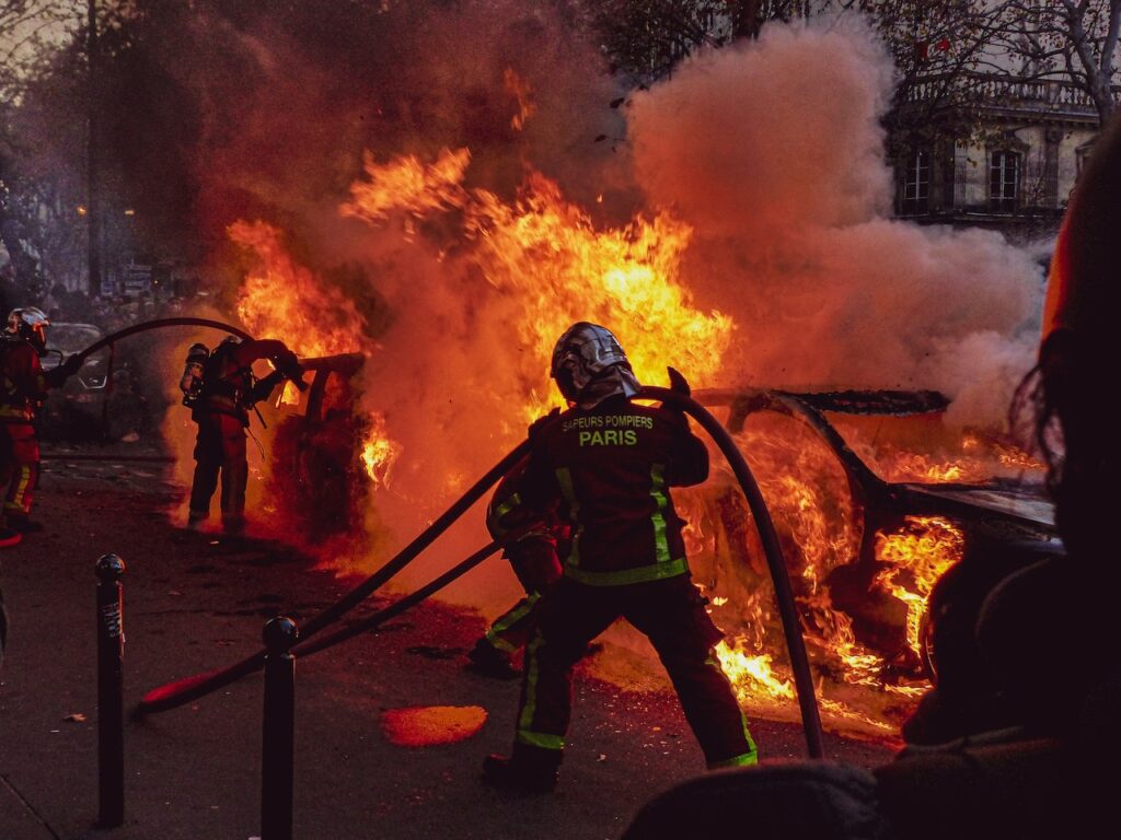 Firefighters Extinguishing a Car Fire