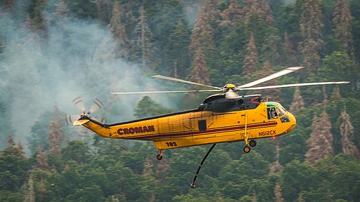 firefighting helicopter drops water